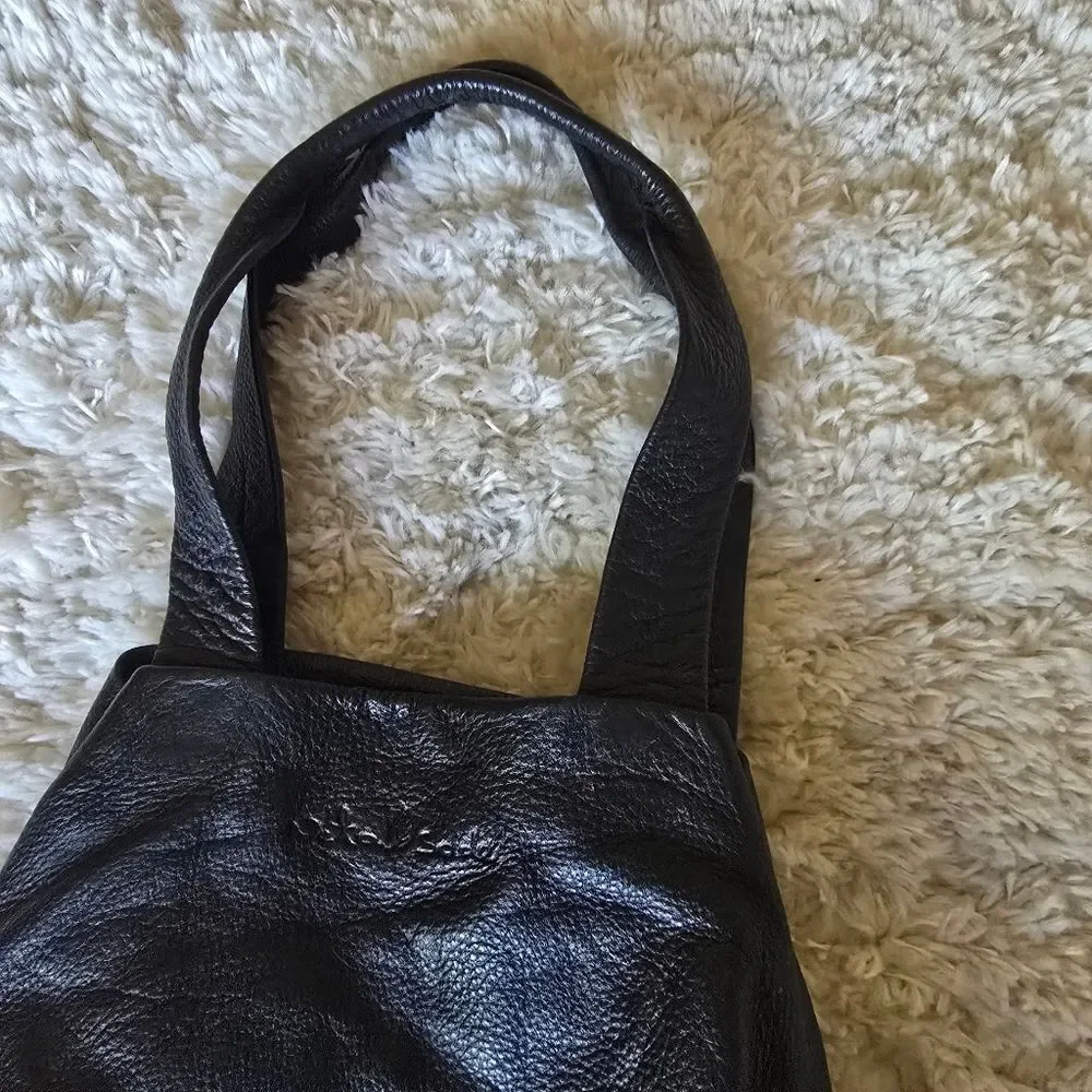 Neta Sade black leather‎ hobo purse.
